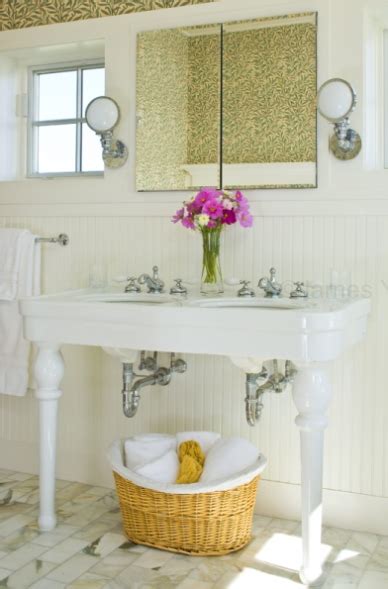 Unlike a pedestal sink, this model offers space between the legs to store a basket of towels or other bath supplies. Parisian Pedestal Sink - Cottage - bathroom - My Home Ideas