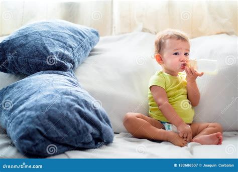 Beautiful 1 Year Old Baby Girl Drinking Breast Milk From Her Bottle