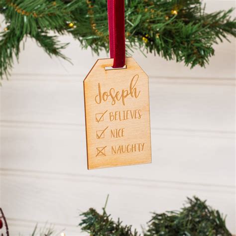 Try handmade approach with christmas decorations as well: Personalised Naughty Or Nice Christmas Tree Decorations By ...