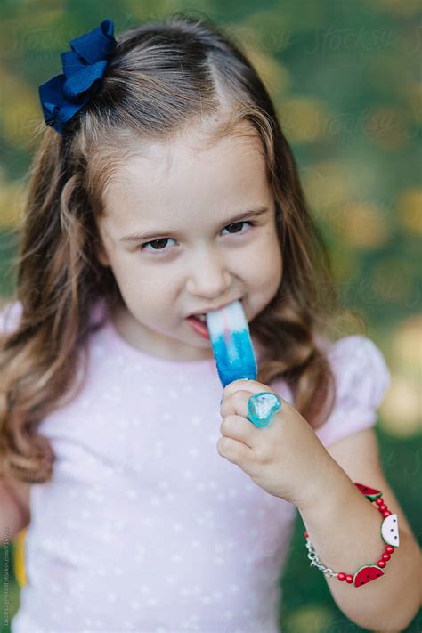 Beautiful Young Girl Eating A Popsicle By Jakob Lagerstedt