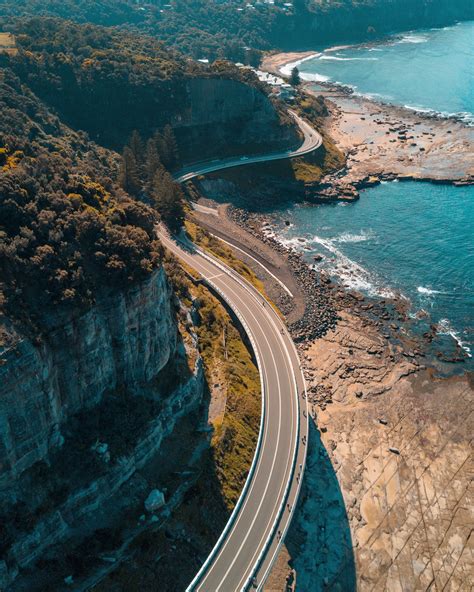 Brown Concrete Road Sea Cliff Bridge Landscape Architecture Trees