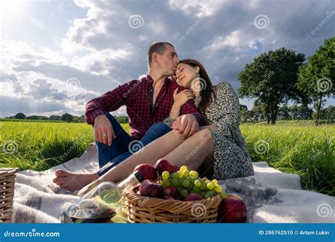 Loving Couple At A Picnic In The Park Stock Photo Image Of Newlyweds