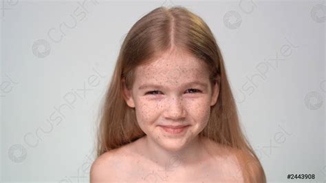 Little Girl With Freckles Blond Hair Is Smiling Stock Photo 2443908