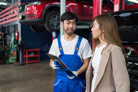 Professional Vehicle Maintenance Man Holding Clipboard And Talk With