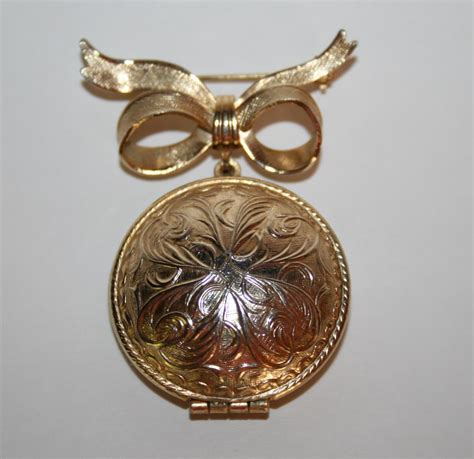 Vintage Avon Gold Toned Perfume Locket Bow Brooch J2 Gem