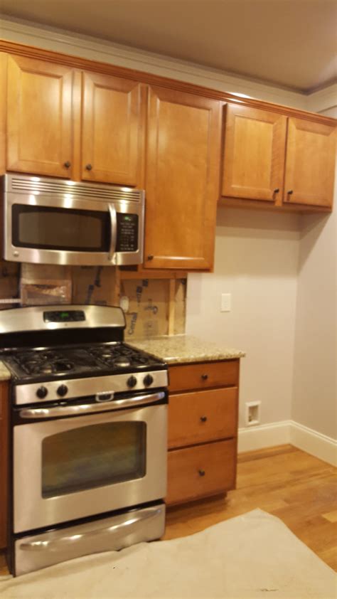 They were spray painted using an 395 air assisted sprayer from the 'corbals' under the island and the range hood will be a real challenge to finish in a solid white. High Reflective White Kitchen + Island - 2 Cabinet Girls