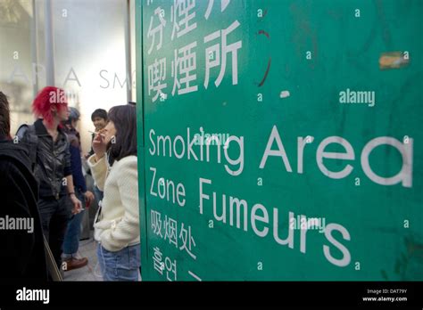 Young People At Smoking Area Outside Shibuya Station Tokyo Japan