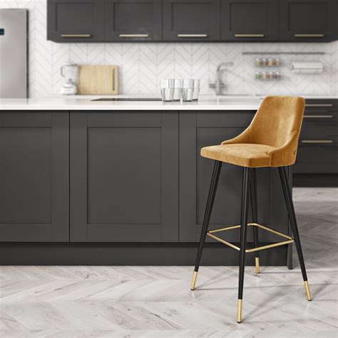 Choose this counter stool for areas with a modern or contemporary style. Mustard Yellow Velvet Bar Stool with Button Back & Black ...