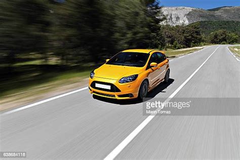 Yellow Car Driving Away Photos And Premium High Res Pictures Getty Images
