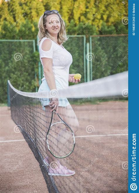 Blonde On The Tennis Court Holding A Ball And A Racket Stock Image Image Of Person Lifestyle