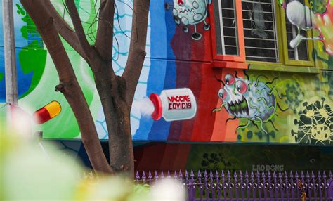 Search vaccines.gov, text your zip code to 438829, or call. Hanoi house covered by Covid-19 prevention graffiti