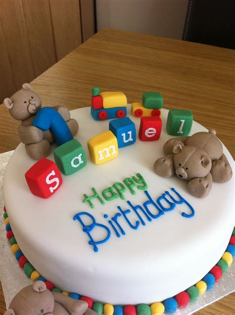 Baby boy 1st first one birthday high chair decoration banner and cake topper. Caked in Icing: First Birthday Cake