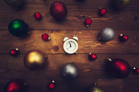 Premium Photo Alarm Clock Showing Midnight And Multicolored Christmas