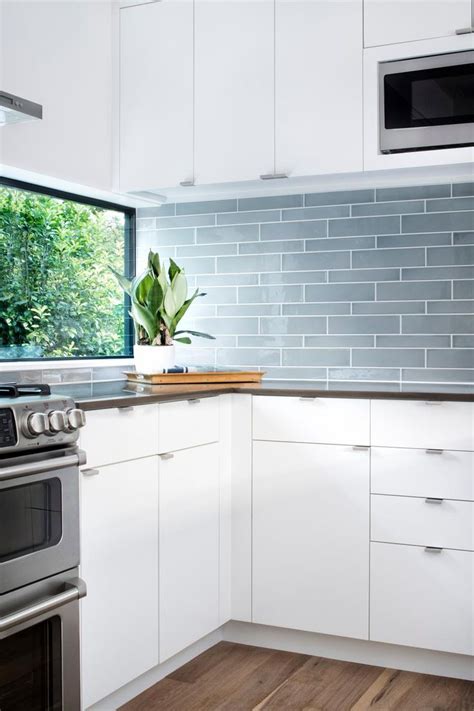 Blue Gray Glass Tile Backsplash Adds Color To Sleek Modern Kitchen