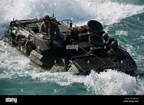 Marines Drive An Amphibious Assault Vehicle Into The Well Deck Of Uss