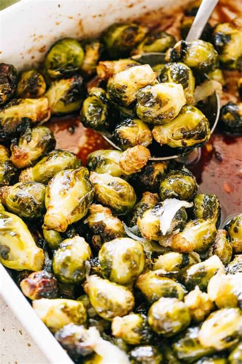 Trim bottom of brussels sprouts, and slice each in half top to bottom. Oven Roasted Brussels Sprouts with Honey Balsamic Glaze ...