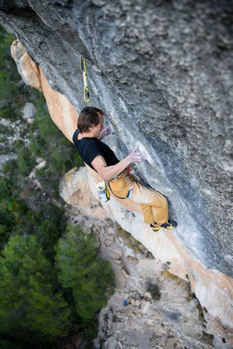 Rock Climber Professional Athlete Climbing In Siurana Rocks Spain