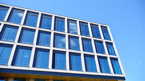 Modern Office Building Windows With Vertical Lines And Reflection