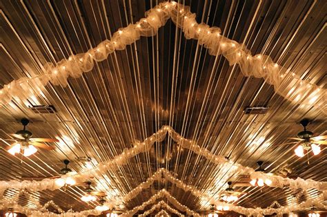 To decorate the ceiling of a party room, you need a few yards of fabric, some embellishments and a little creativity. Crinkly fabric garland with lights | Ceiling, Ceiling decor, Light garland
