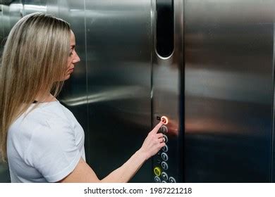 Woman Standing Elevator Pressing Button Stock Photo 1987221218