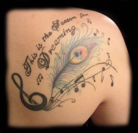 Back tattoo, peacock tattoo, feather tattoo, music tattoo, lettering tattoo, shoulder tattoo 