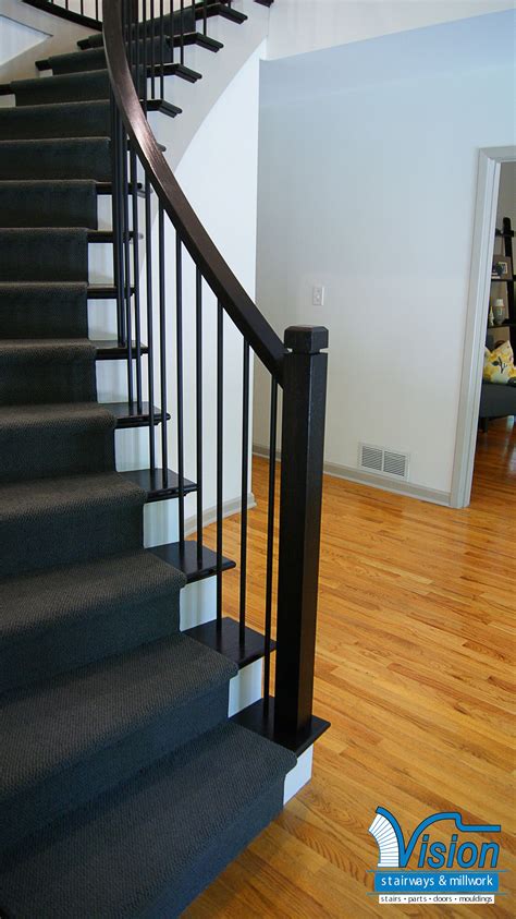 If you are looking for cable railing system with a wood handrail, the sunrail™ latitude system is an excellent choice. Curved staircase with iron railing and balusters, with ebony stained wooden newels and retu ...