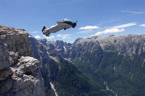 Wingsuit Base Jumper Is Flying From A Cliff Italian Alps Alleghe