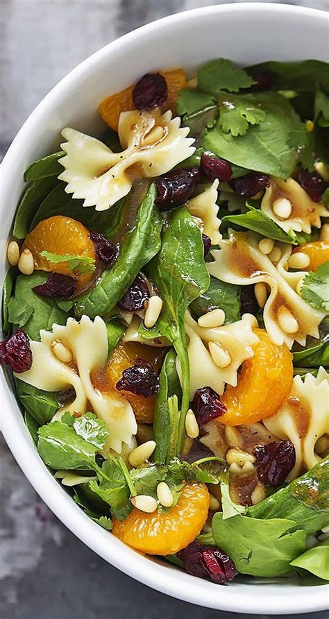 In a large bowl toss together pasta, spinach, raisins, nuts, mandarin oranges, and cilantro. Pasta Salad Recipe - Mandarin Pasta Spinach Salad with ...