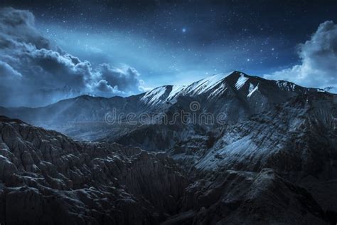 Beautiful Landscape Snow Mountains At Night On Blue Cloud And Star