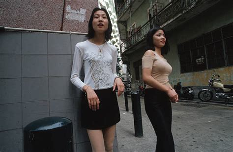 Young Mainland China Prostitutes Waiting For Customers Along