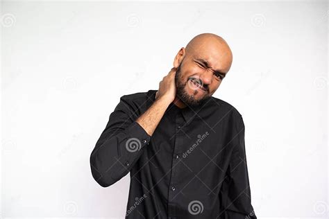 Portrait Of Frowning Young Businessman Rubbing Neck Stock Image Image