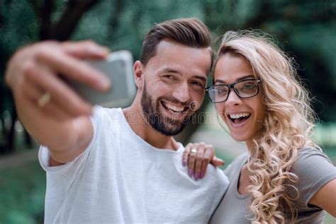 Close Upsmiling Young Couple Taking Selfie In City Park Stock Image Image Of Self Selfie
