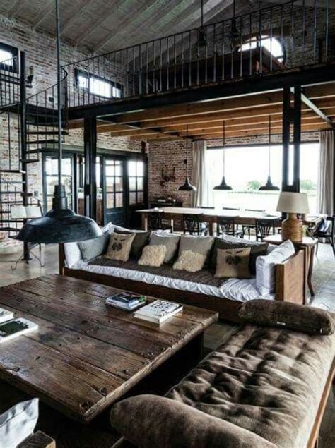 A Moody Industrial Barndominium Space With Brick Walls Dark Stained