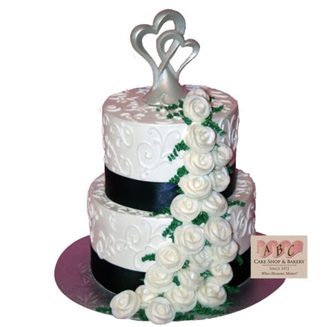 2136 2 Tier White Cake With Frosting Flowers Cascading Down Abc