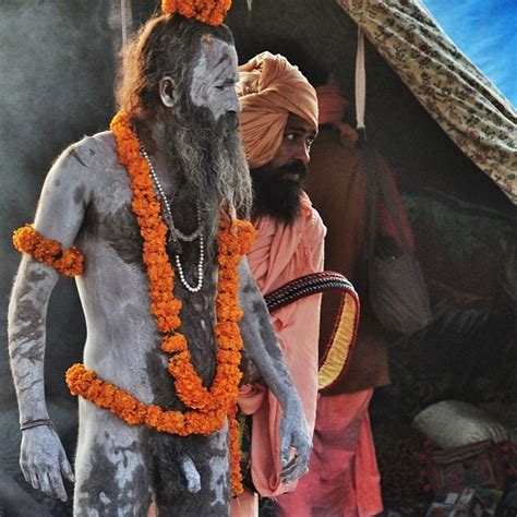 A Regular Sadhu Helping A Naga Baba Dress Up Before The Pr Flickr