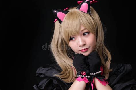 Japan Anime Cosplay Portrait Of Girl Cosplay Isolated In Black Room