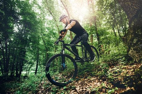 Professional Mountain Bike Cyclist Riding Trail In Forest Details Of