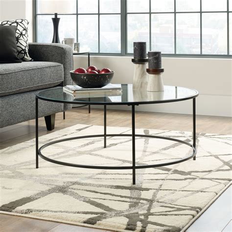 The golden leaf round coffee table represents a blend of modern style and superior craftsmanship. Round Contemporary Coffee Table in Black | Mathis Brothers ...