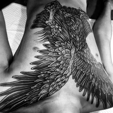 This feather tattoo with birds looks quite lively. 60 Bird Tattoos For Men - From Owls To Eagles