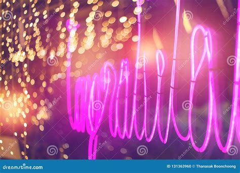 Abstract Pink Neon Sign With Blurred Neon Tube Light Background