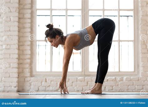 Young Sporty Attractive Woman Practicing Yoga Standing Half For Stock