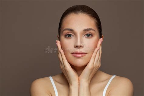 Cute Young Woman Spa Model With Clear Skin On Brown Background