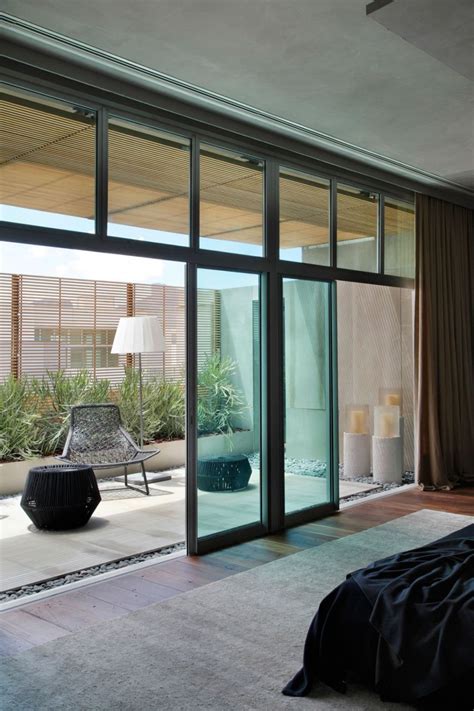 Sliding wardrobe mirror glass gloss panel doors. Art-Filled Bachelor Pad With Cool Design