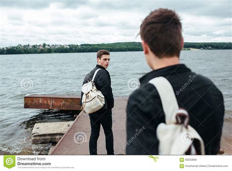 Two Young Guys Standing On A Pier Stock Photo Image Of Peaceful Lake