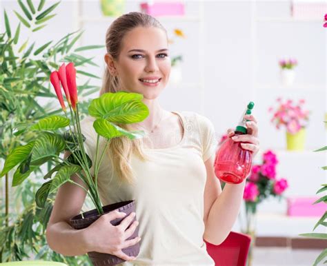 Young Woman Watering Plants In Her Garden Stock Image Image Of Garden