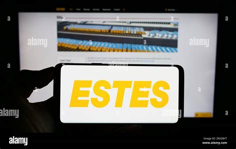 Person holding mobile phone with logo of American logistics company