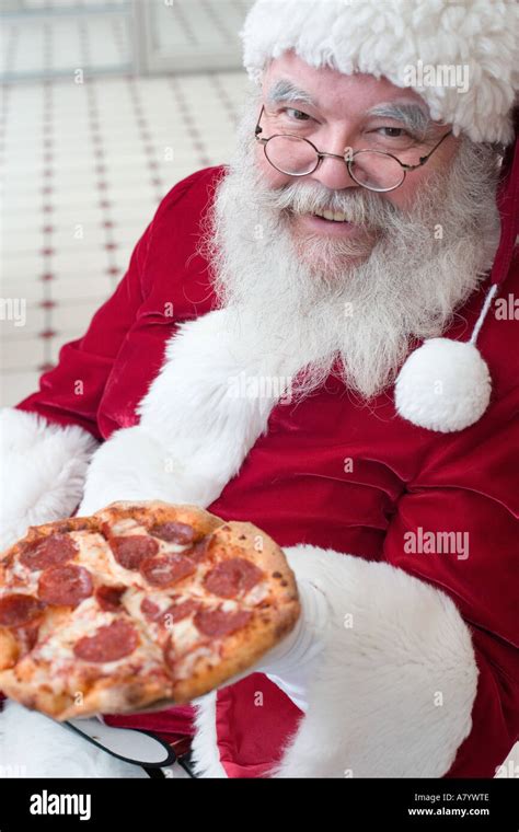 Santa Claus Eating Pizza Stock Photo Alamy