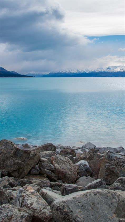 Wallpaper Lake Pukaki New Zealand Stones Clouds Mountains 4k