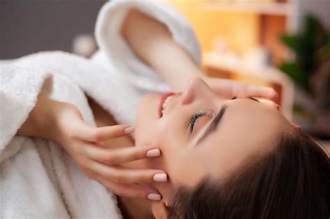 Premium Photo Pretty Woman Receiving Facial Massage In Spa Salon