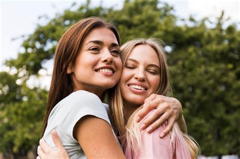 Free Photo Two Female Friends Hugging Each Other Outdoors